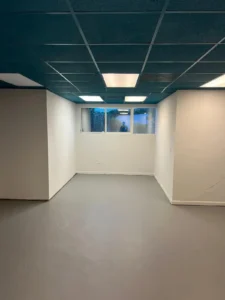 commercial interior after ceiling tiles and gray floor installation in Miami
