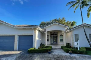 Modern white and gray house exterior after painting in Miami