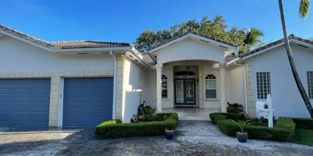 Modern white and gray house exterior after painting in Miami