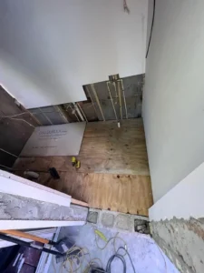 Plumbing and framing in process during bathroom construction in Miami apartment