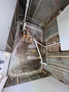 Initial stage of new bathroom construction replacing laundry room in Miami