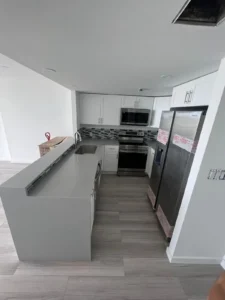 Completed kitchen with modern finishes and appliances - side angle - Miami